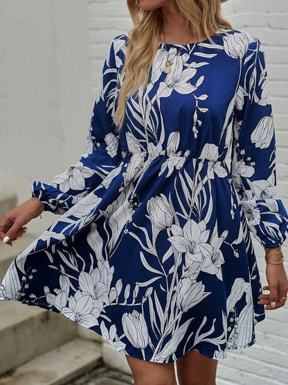 Woman wearing floral round neck long sleeve mini dress from Parnovs Store