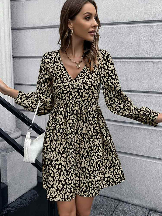 Woman wearing Animal Print Buttoned V-Neck Long Sleeve Black Dress from Parnov.Store