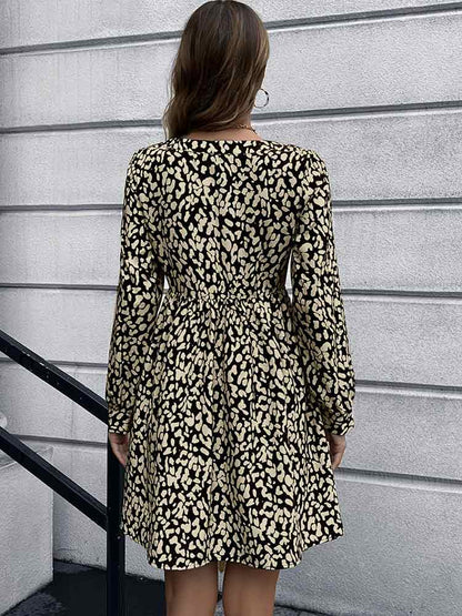 Woman wearing Animal Print Buttoned V-Neck Long Sleeve Black Dress from Parnov.Store