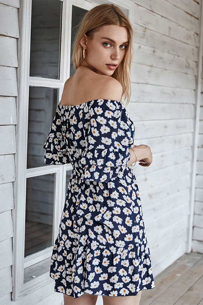 woman wearing dainty daisy off the shoulder navy dress from Parnova.Store