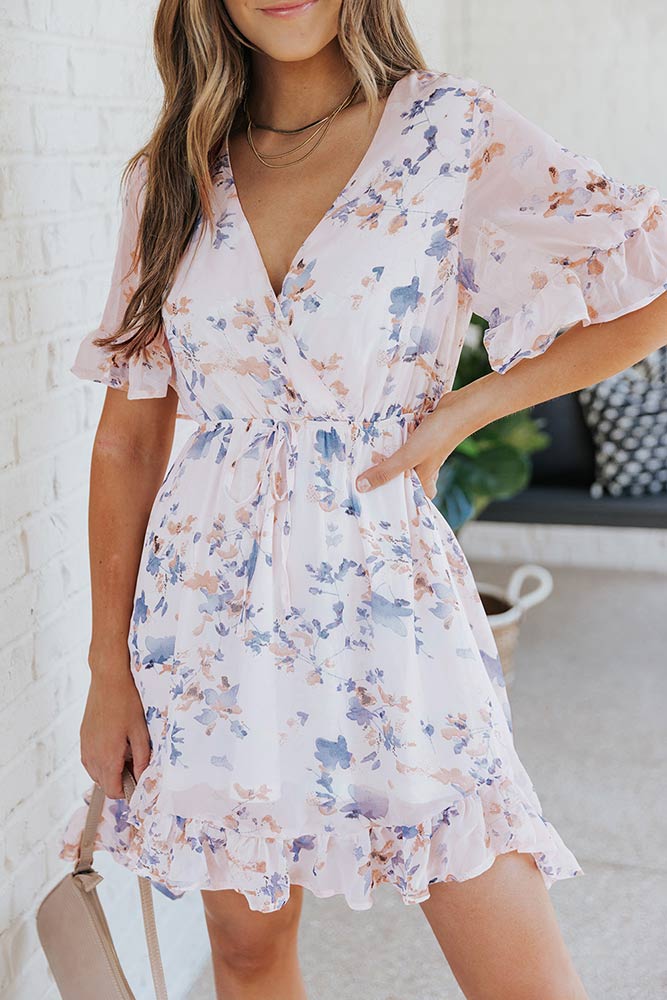 woman wearing Floral Drawstring Waist Ruffled Surplice Dress from Parnova.Store