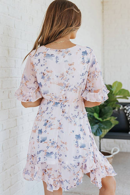 woman wearing Floral Drawstring Waist Ruffled Surplice Dress from Parnova.Store