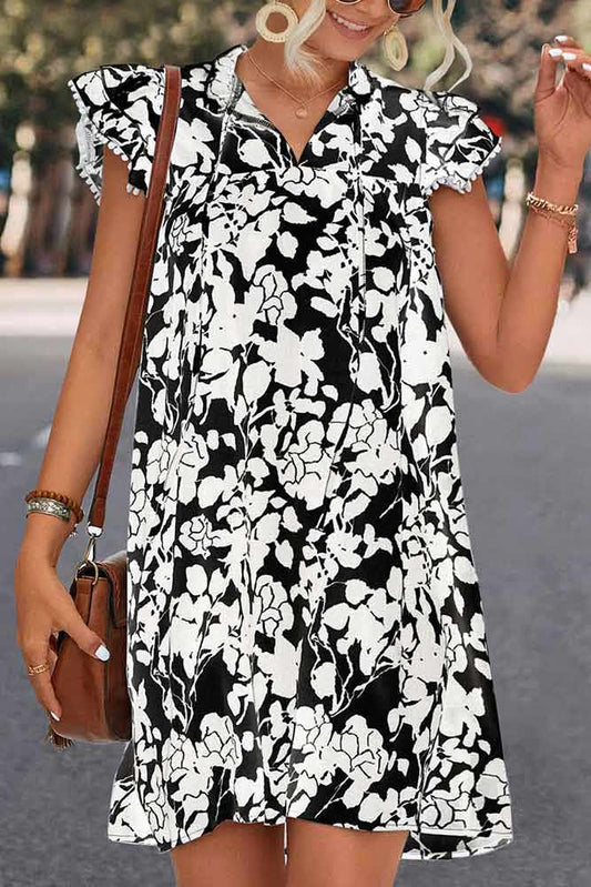 Woman wearing Floral Tie Neck Butterfly Sleeve Dress by Parnova.Store