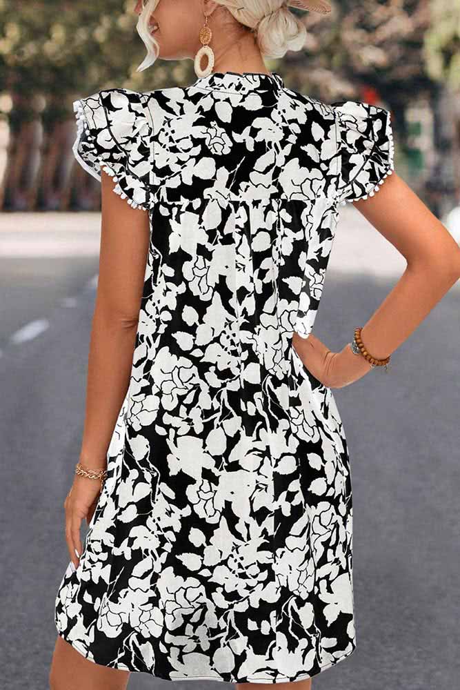 Woman wearing Floral Tie Neck Butterfly Sleeve Dress by Parnova.Store